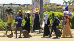 Sudan residents flee the city